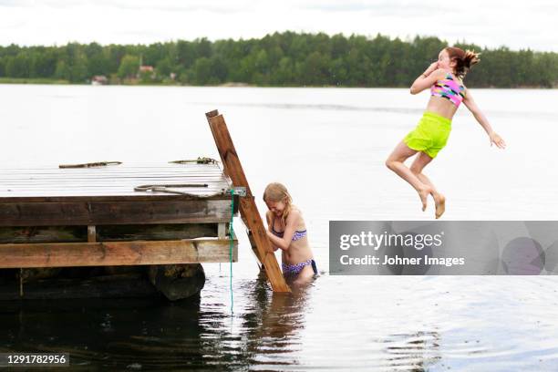 girls having fun at sea - bathing jetty stock pictures, royalty-free photos & images