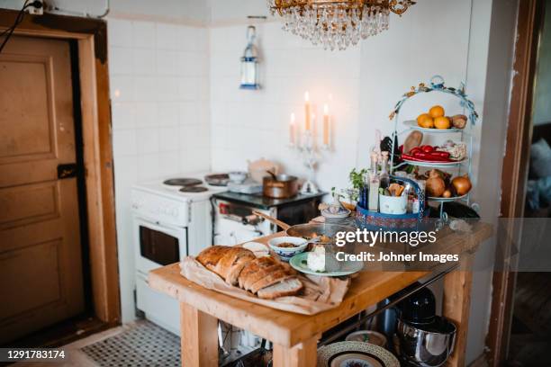 view of kitchen with food on table - kitchen island stock pictures, royalty-free photos & images