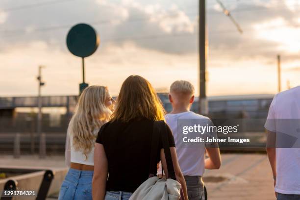 young friends walking together - göteborg stad bildbanksfoton och bilder