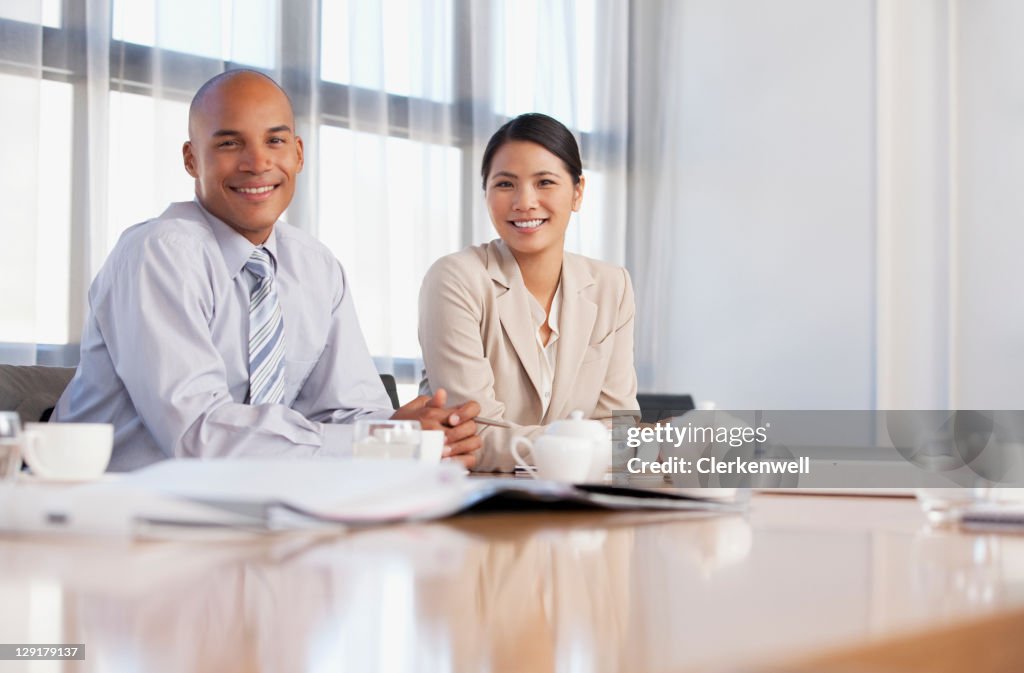 Business associates smiling together