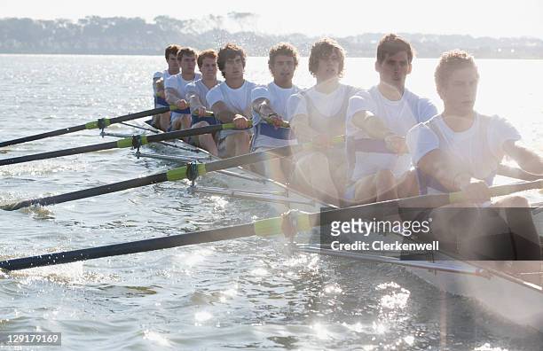 male team in a race of canoe - rowing fotografías e imágenes de stock
