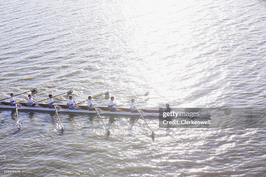 High angle view of people in canoe oaring