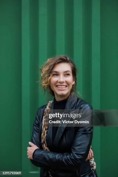 outdoor portrait of the young smiling woman - leopard print stock pictures, royalty-free photos & images