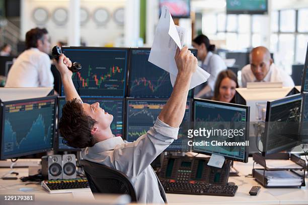 businessman celebrating success - traders stockfoto's en -beelden