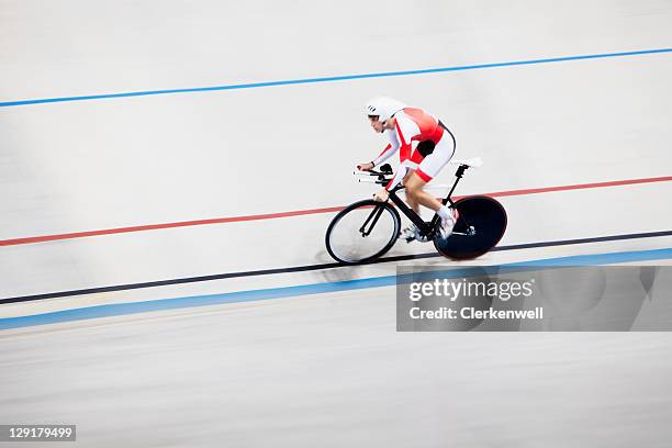 high angle view of person riding bicycle in race - track cycling stock pictures, royalty-free photos & images