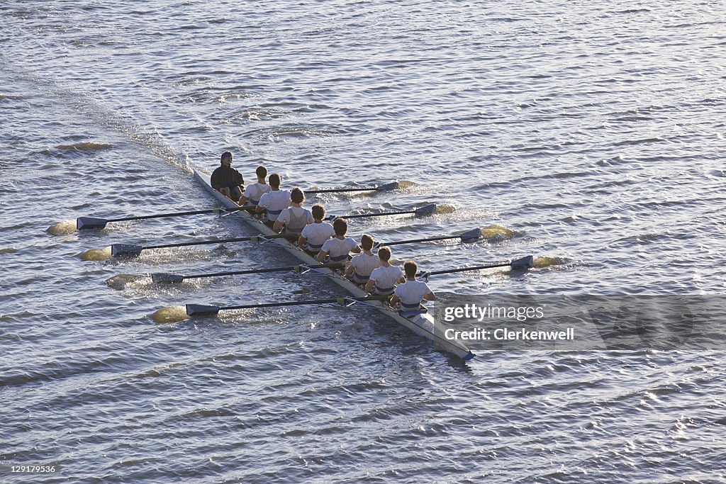 High angle view of people sitting in a row in a canoe