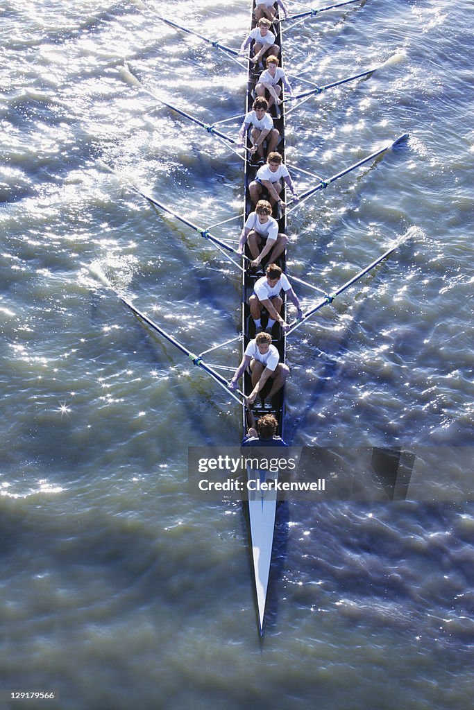 High angle view of people in long canoe