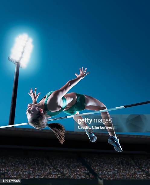 female athlete performing high jump - high jump stock pictures, royalty-free photos & images