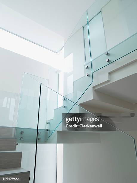 low angle view of staircase with glass railing - railings 個照片及圖片檔