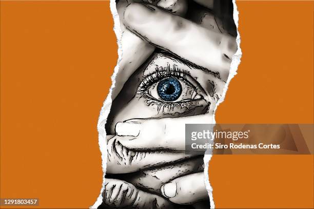 woman with her hands covering her face and looking with panic eyes through a torn orange cardboard - nachsteller stock-fotos und bilder