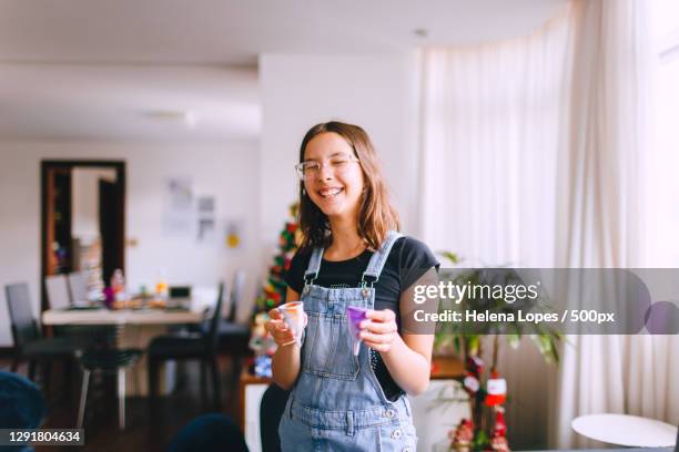 smiling teenage girl holding reusable menstrual cup,belo horizonte,state of minas gerais,brazil - menstrual cup stock pictures, royalty-free photos & images