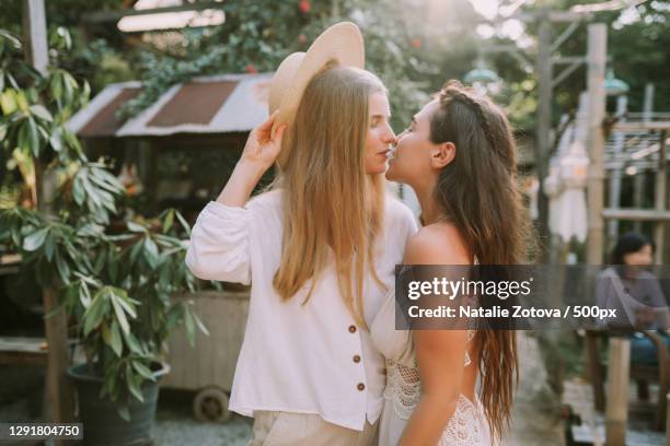 lesbian couple enjoying romantic moment while traveling,chiang mai,thailand - asian lesbians kiss stock pictures, royalty-free photos & images