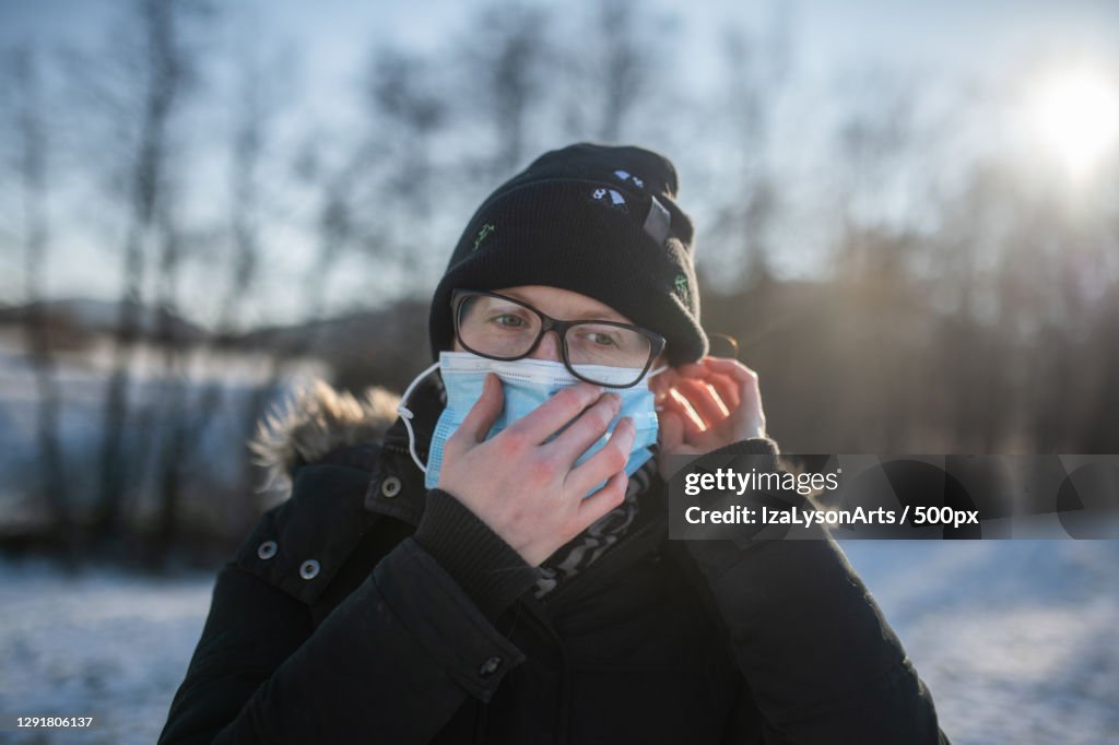 Woman on Winter walk with face mask,Poland