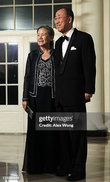 United Nations Secretary General Ban Ki-moon and his wife Ban Soon-taek arrive at a state dinner at the White House October 13, 2011 in Washington,...