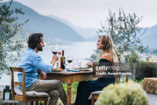 couple enjoy a healthy lunch in an italian vineyard - ticino canton stock pictures, royalty-free photos & images