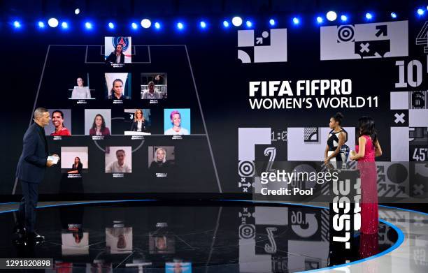 Ruud Gullit, Laura Georges and Reshmin Chowdhury present the FIFA FIFAPRO Women's World 11 team during the The Best FIFA Football Awards on December...