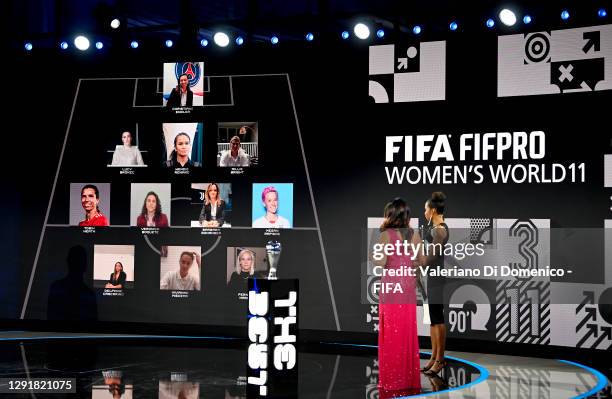 In this handout image provided by FIFA, Laura Georges and Reshmin Chowdhury present the FIFA FIFAPRO Women's World 11 team during the The Best FIFA...