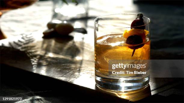 classic prohibition manhattan cocktail in old fashioned rocks glass. - rye new york stock pictures, royalty-free photos & images