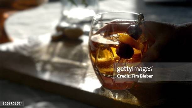 classic prohibition manhattan cocktail in old fashioned rocks glass. - rye new york stock pictures, royalty-free photos & images