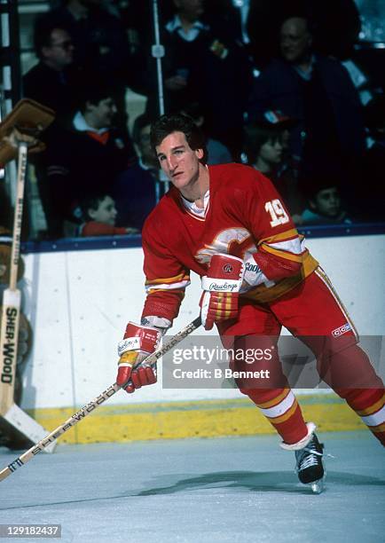 Tim Hunter of the Calgary Flames warms-up before an NHL game against the New York Islanders on February 19, 1985 at the Nassau Coliseum in Uniondale,...