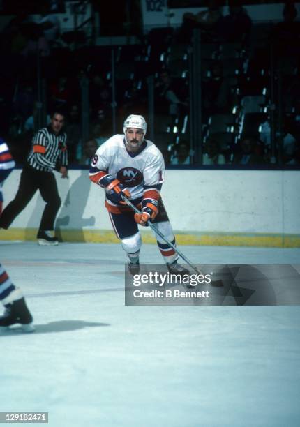 Bryan Trottier of the New York Islanders skates with the puck during an NHL game against the New York Rangers on October 19, 1985 at the Nassau...