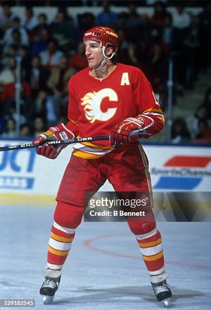 Tim Hunter of the Calgary Flames skates on the ice during an NHL game against the New York Islanders on March 27, 1990 at the Nassau Coliseum in...