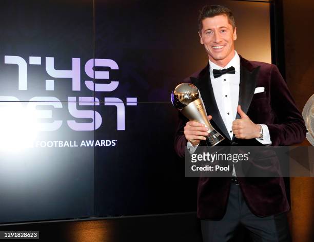 Robert Lewandowski of FC Bayern Muenchen poses after winning the FIFA Men's Player 2020 trophy during the FIFA The BEST Awards ceremony on December...
