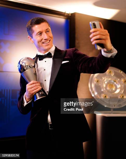 Robert Lewandowski of FC Bayern Muenchen poses after being awarded as FIFA Men's Player 2020 during the FIFA The BEST Awards ceremony on December 17,...