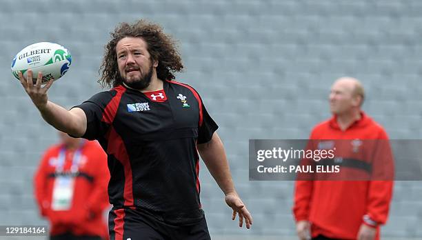 Wales' prop Adam Jones catches the ball during the captain's run at Eden Park in Auckland on October 14 on the eve of their 2011 Rugby World Cup...