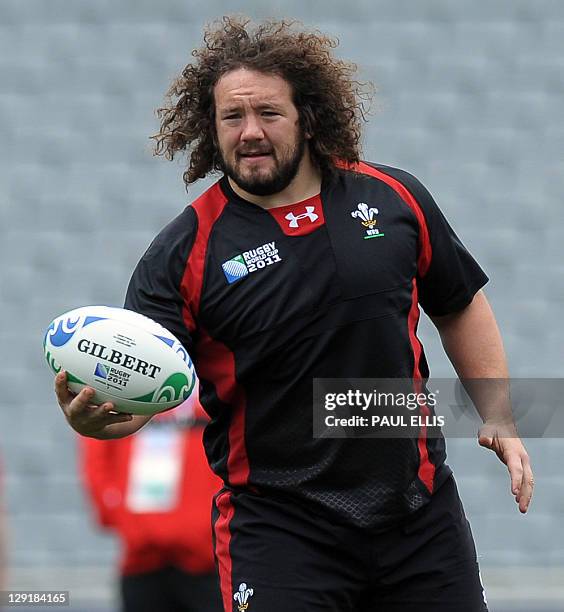 Wales' prop Adam Jones catches the ball during the captain's run at Eden Park in Auckland on October 14 on the eve of their 2011 Rugby World Cup...