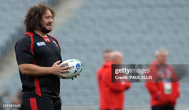 Wales' prop Adam Jones holds the ball during the captain's run at Eden Park in Auckland on October 14 on the eve of their 2011 Rugby World Cup...