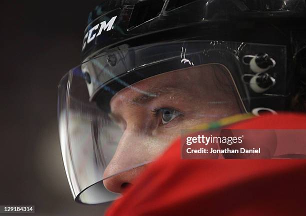 Duncan Keith of the Chicago Blackhawks watches as his teammates take on the Winnipeg Jets at the United Center on October 13, 2011 in Chicago,...