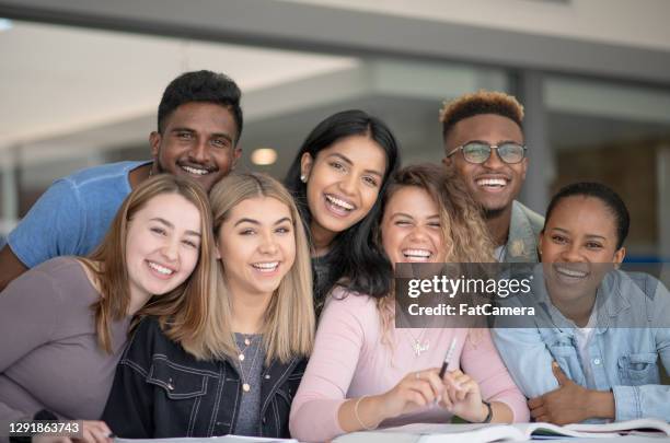 smiling group of multi ethnic university students - study abroad stock pictures, royalty-free photos & images