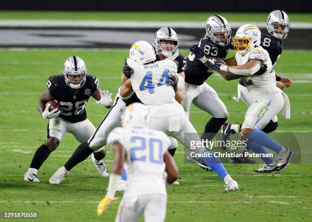 Running back Josh Jacobs of the Las Vegas Raiders rushes the ball during the second half against the Los Angeles Chargers at Allegiant Stadium on...