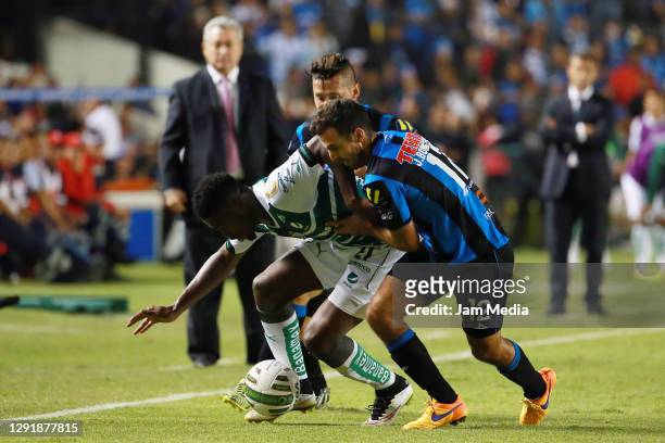 Jorge Djaniny Tavares of Santos fights for the ball with Jonathan Bornstein of Queretaro during the final match of the 2015 Clausura Tournament...