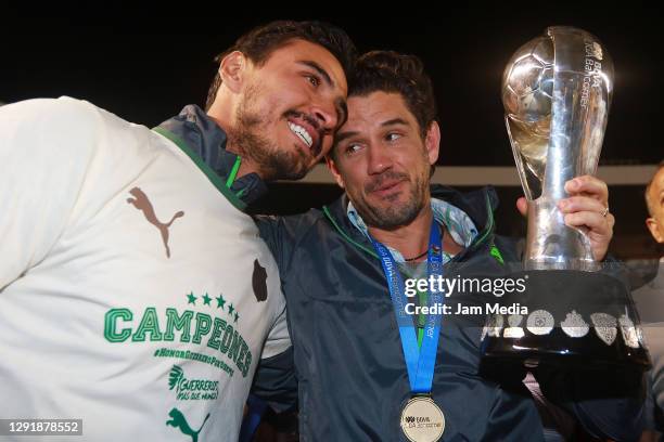 Oswaldo Alanis and Alejandro Irarragorri, President of Santos, celebrate the championship title after defeating Queretaro in the final match of the...