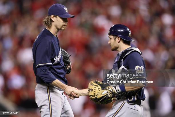 John Axford and Jonathan Lucroy of the Milwaukee Brewers celebrate after they won 4-2 against the St. Louis Cardinals during Game 4 of the National...
