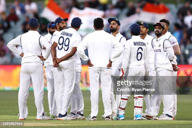 The Indian team watch the big screen after Marnus Labuschagne of Australia called for a DRS review after being dismissed by Umesh Yadav of India...
