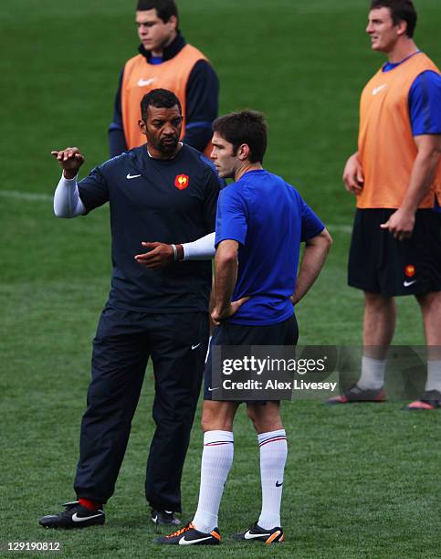 Backs coach Emile Ntamack talks with Dimitri Yachvili during a France IRB Rugby World Cup 2011 captain's run at Eden Park on October 14, 2011 in...