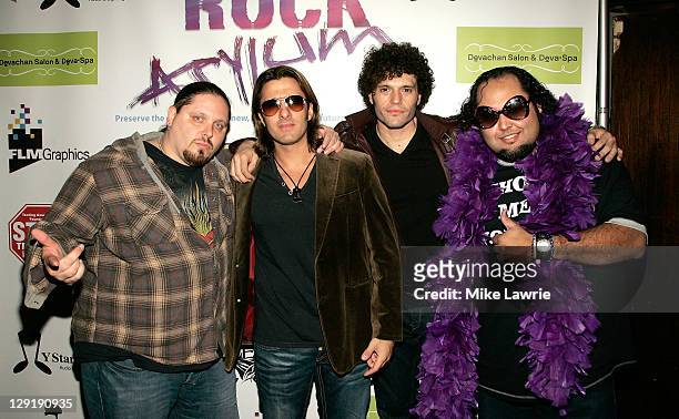 Wrestler Brimstone and Ed "Luscious" Castillo pose with Joey Cassata and Paulie Z of ZO2 at ZO2's Rock Asylum Benefit Concert at the Hiro Ballroom at...