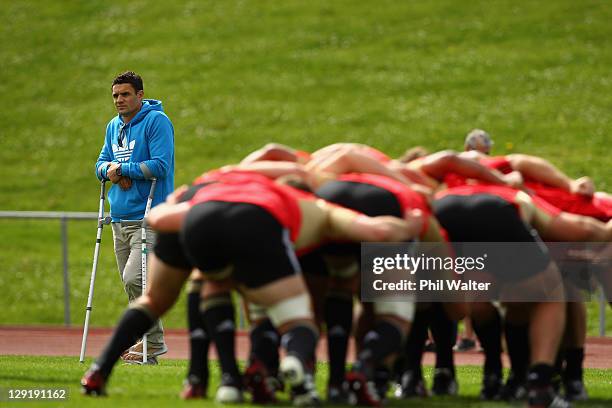 Dan Carter looks on as he recovers from injury during a New Zealand All Blacks IRB Rugby World Cup 2011 training session at Trusts Stadium on October...