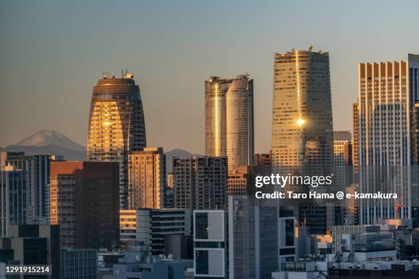 snowcapped mt. fuji and city buildings in tokyo of japan - roppongi hills stock pictures, royalty-free photos & images