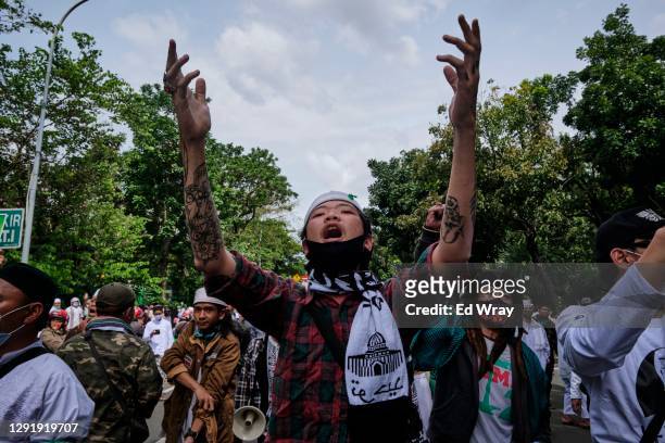 Indonesian supporters of hardline cleric Habib Rizieq call for his release during a demonstration which police quickly dispersed as they were lacking...
