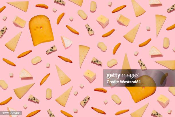 varieties of cheese and bread sticks on pink background - ost bildbanksfoton och bilder