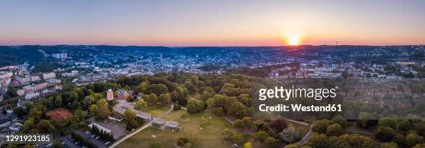 germany, north rhine-westphalia, wuppertal, aerial panorama of hardt park at sunset - wuppertal bildbanksfoton och bilder