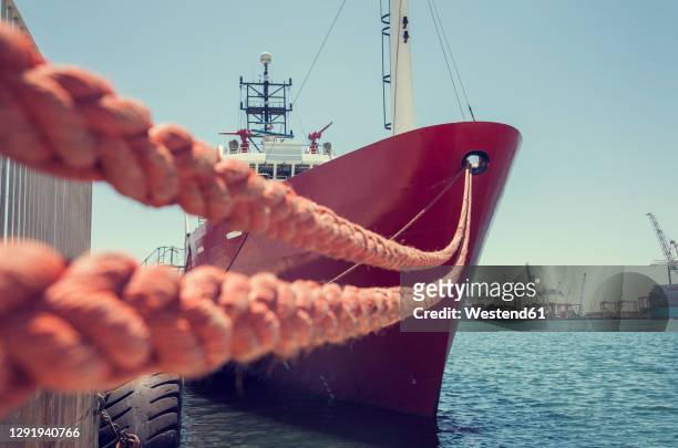 south africa, western cape, cape town, cargo ship moored in harbor - moored stock pictures, royalty-free photos & images