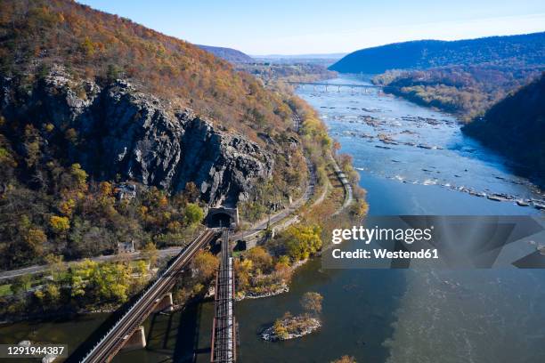 usa, west virginia, harpers ferry, aerial view of elevated railroad tracks meeting at tunnel overchesapeake and ohio canal - chesapeake and ohio canal national park stock pictures, royalty-free photos & images