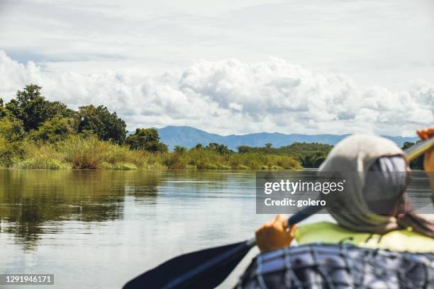 canoeing on the zambezi river in zambia - zambezi river stock pictures, royalty-free photos & images