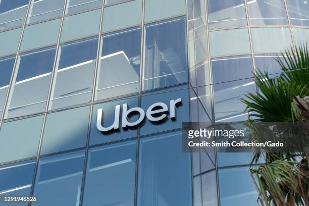 Logo is visible on facade at headquarters of ridesharing company Uber in Mission Bay, San Francisco, California, November 19, 2020.
