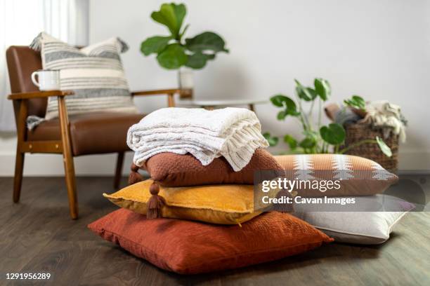 fall pillows and blanket stacked up - cushion imagens e fotografias de stock